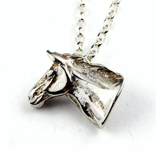 Horse head pendant made of sterling silver. Handmade by Elena Brennan in Cavan, Ireland.