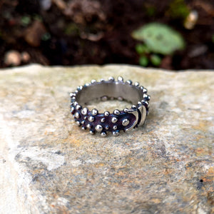 Blackened sterling silver Bubble Ring with a buckle effect pattern and little bubble decorations. Designed and handmade in Ireland.