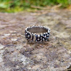 Blackened sterling silver Bubble Ring with a buckle effect pattern and little bubble decorations. Designed and handmade in Ireland.