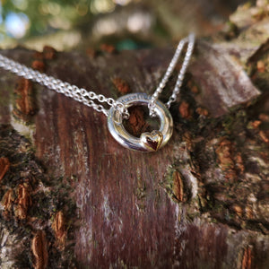 Elena's Embrace of the Angels Necklet, handcrafted from sterling silver complete with a 10ct rose gold heart.  From Elena Brennan's Irish handmade angel jewelry collection