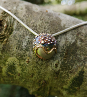 The Small Cúrsa an tSaoil Pendant is handmade from sterling silver by Elena Brennan Jewellery.