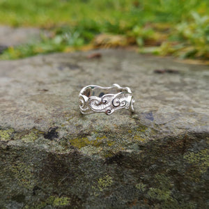 Detailing of the Celtic Spirals wedding ring by Elena Brennan. This Irish wedding ring is decorated with Celtic spirals and is handmade in Ireland.