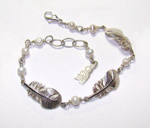 Sterling Silver Baby Angel Feather Bracelet with pearl detailing.