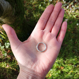 The Angel Halo Ring in the palm of Irish Jewellery Designer Elena Brennan to show its size.
