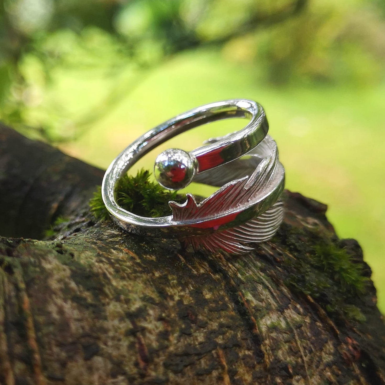 Earth Angel Feather Ring handcrafted in sterling silver by Elena Brennan Jewellery, photographed in a nature setting