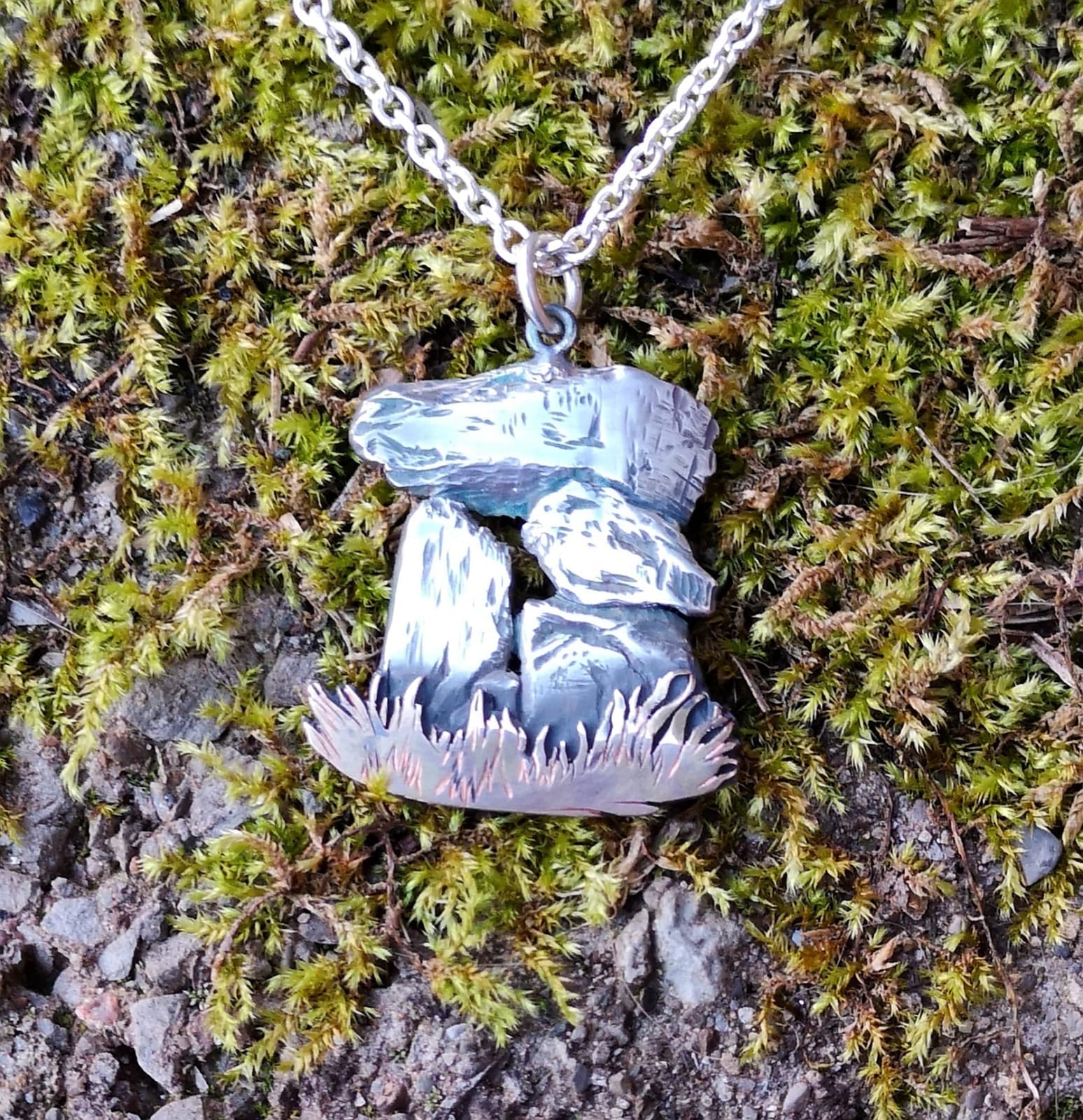 A unique irish pendant of the Aughnacliffe Dolmen handmade by Elena Brennan Jewellery in Ireland.