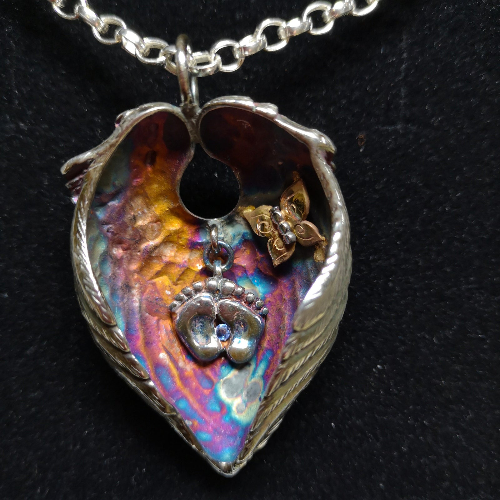 A bespoke guardian angel pendant with baby feet remembering a baby angel lost too soon, by Irish jewellery designer Elena Brennan