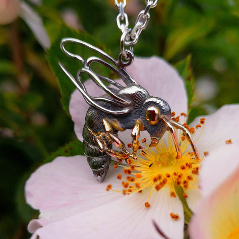 A bespoke three dimensional honey bee pendant handmade by Irish Designer Elena Brennan.