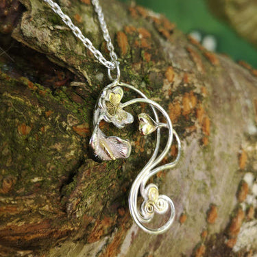 An Éireann Pendant with 14ct gold symbols to represent jewellery inspired by 1916 handmade by Irish jewellery Designer Elena Brennan.