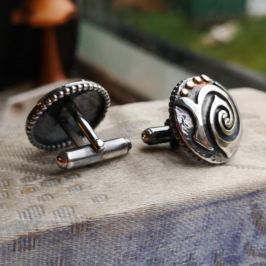 A pair of bespoke cufflinks handmade by Elena Brennan Jewellery for a special 25th Wedding Anniversary present.