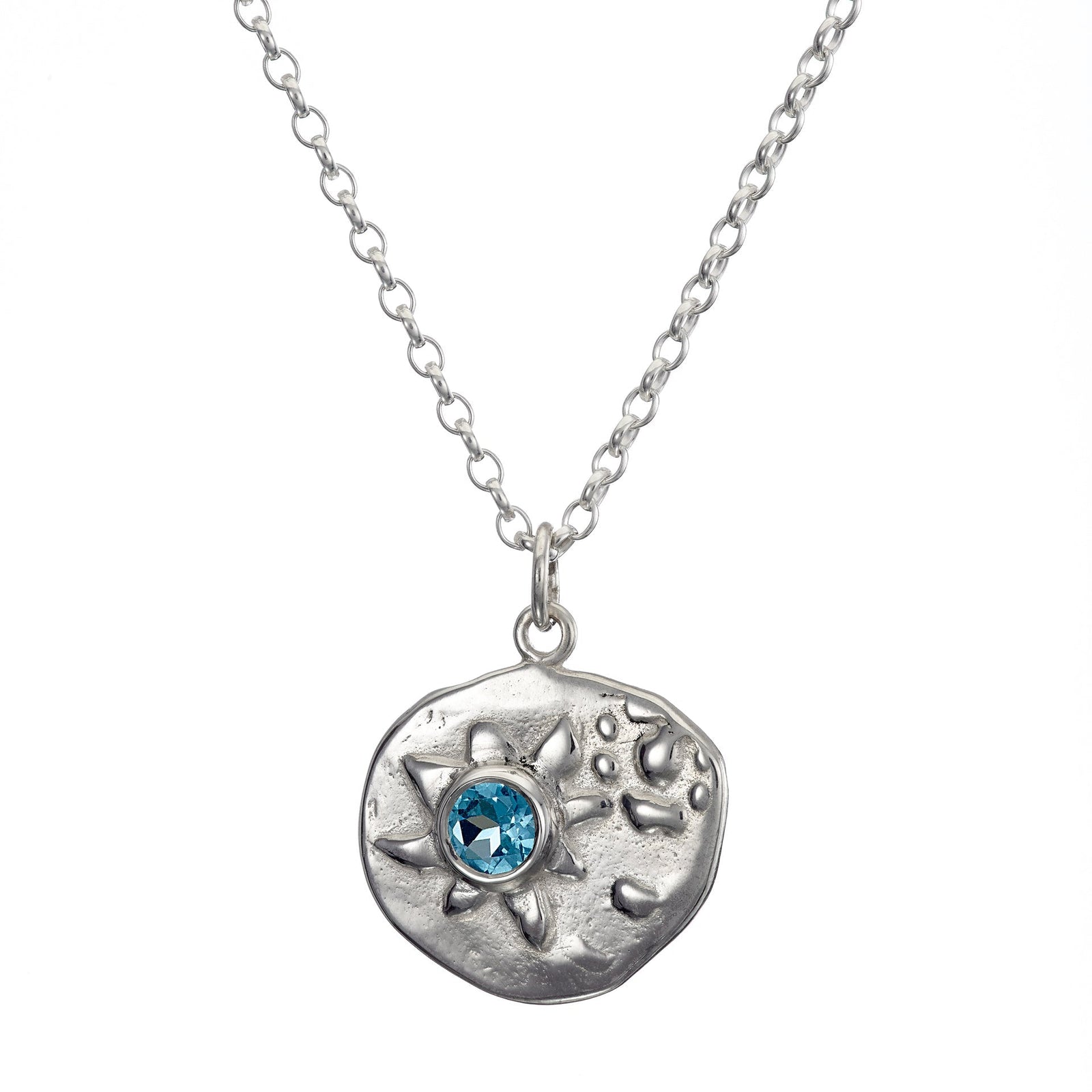 Sea inspired pendant made of sterling silver and a blue topaz set into it, handmade by Irish jewellery designer Elena Brennan in Cavan, Ireland