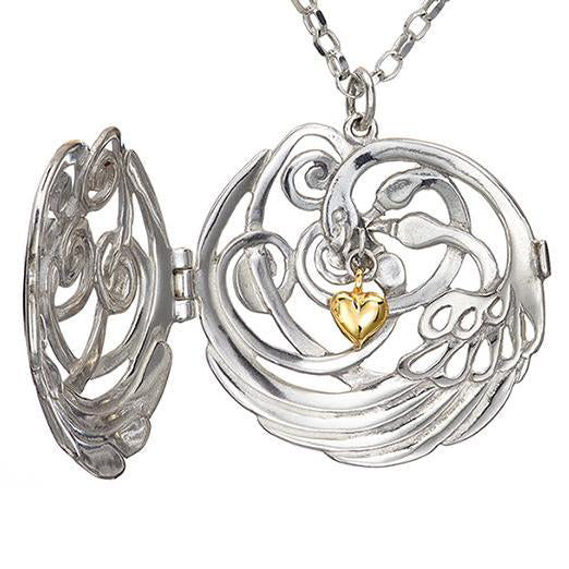 Beautiful swan locket swan pendant with gold heart, from the handmade Children of Lir jewellery collection.