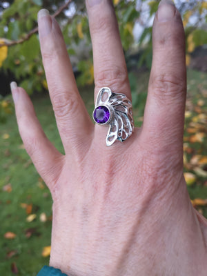 Hand showing off the sterling silver bespoke amethyst gossamer ring.