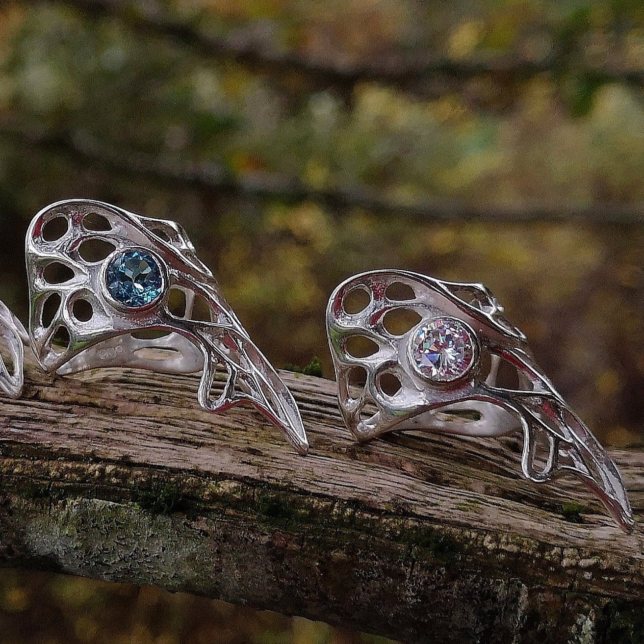 Gorgeous Dainty Gossamer statement Celtic rings with Blue Topaz and cubic zirconia gemstone settings.