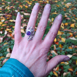 Hand showing off the sterling silver bespoke amethyst gossamer ring.