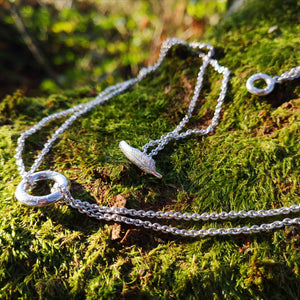 Embrace of the Angels Necklace with silver angel halo.