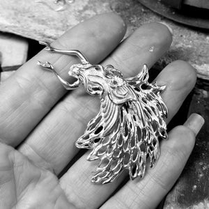 The back view of the sterling silver guardian angel pendant.