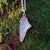 Back of right-folded angel wing pendant made of sterling silver.