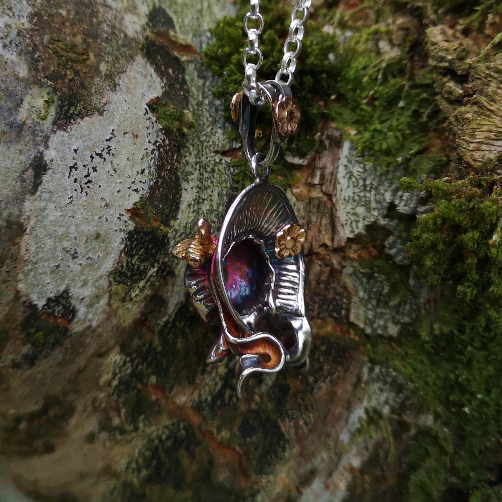 Bonnet silver pendant with a gold flower and bee, handmade by Irish jewellery designer Elena Brennan in Cavan, Ireland.