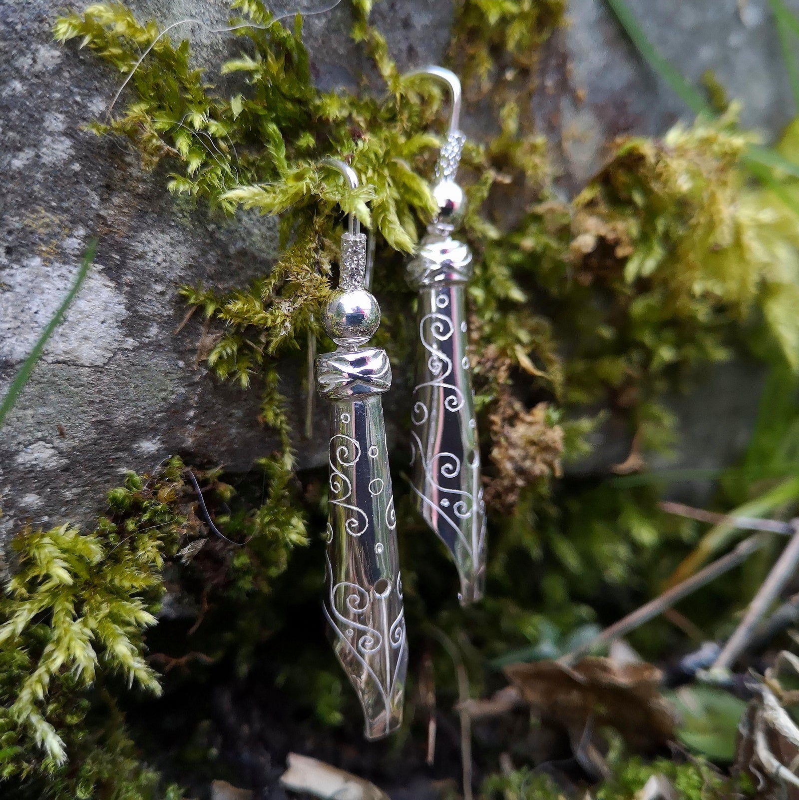 A pair of sterling silver bespoke pen nib earrings, handmade in Cavan by Irish jewellery designer Elena Brennan