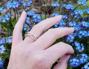 A hand showing off the Cúrsa an tSaoil Circles of Life bespoke ring. Handmade in Ireland.