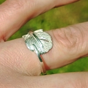 Close up of "Cherish", a sterling silver angel feather ring. Irish handmade jewellery by Elena Brennan made in Cavan Ireland. Part of the My Angel jewellery collection.