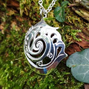 Close-up of the An Cabhán pendant made of sterling silver, inspired by the beautiful landscape of Co. Cavan.