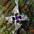 Crusader Children of Lir Cross handcrafted from Sterling Silver with Amethyst gemstone setting. This swan pendant is inspired by the Children of Lir.