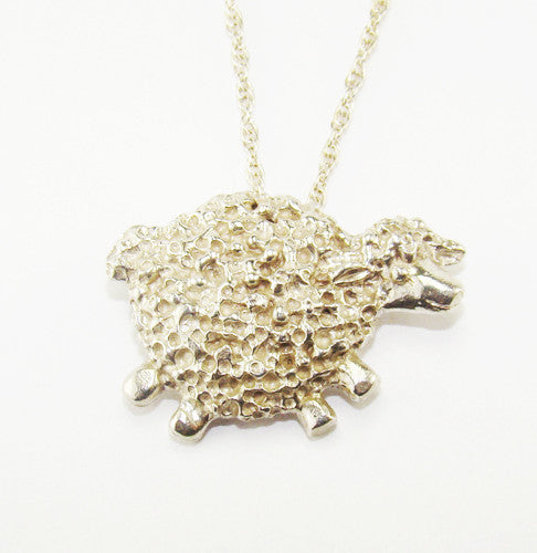 Sterling silver curly sheep pendant, handmade by Irish jewellery designer Elena Brennan in Cavan, Ireland.
