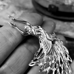 Details of the back of the sterling silver guardian angel pendant.