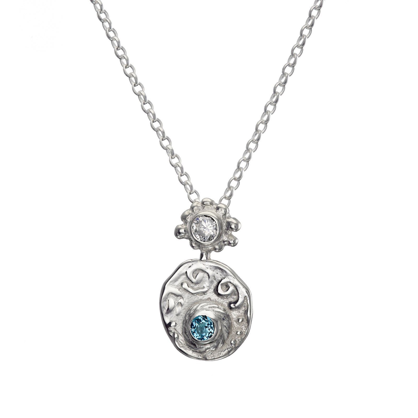 Sea themed pendant made of sterling silver and set with blue topaz.