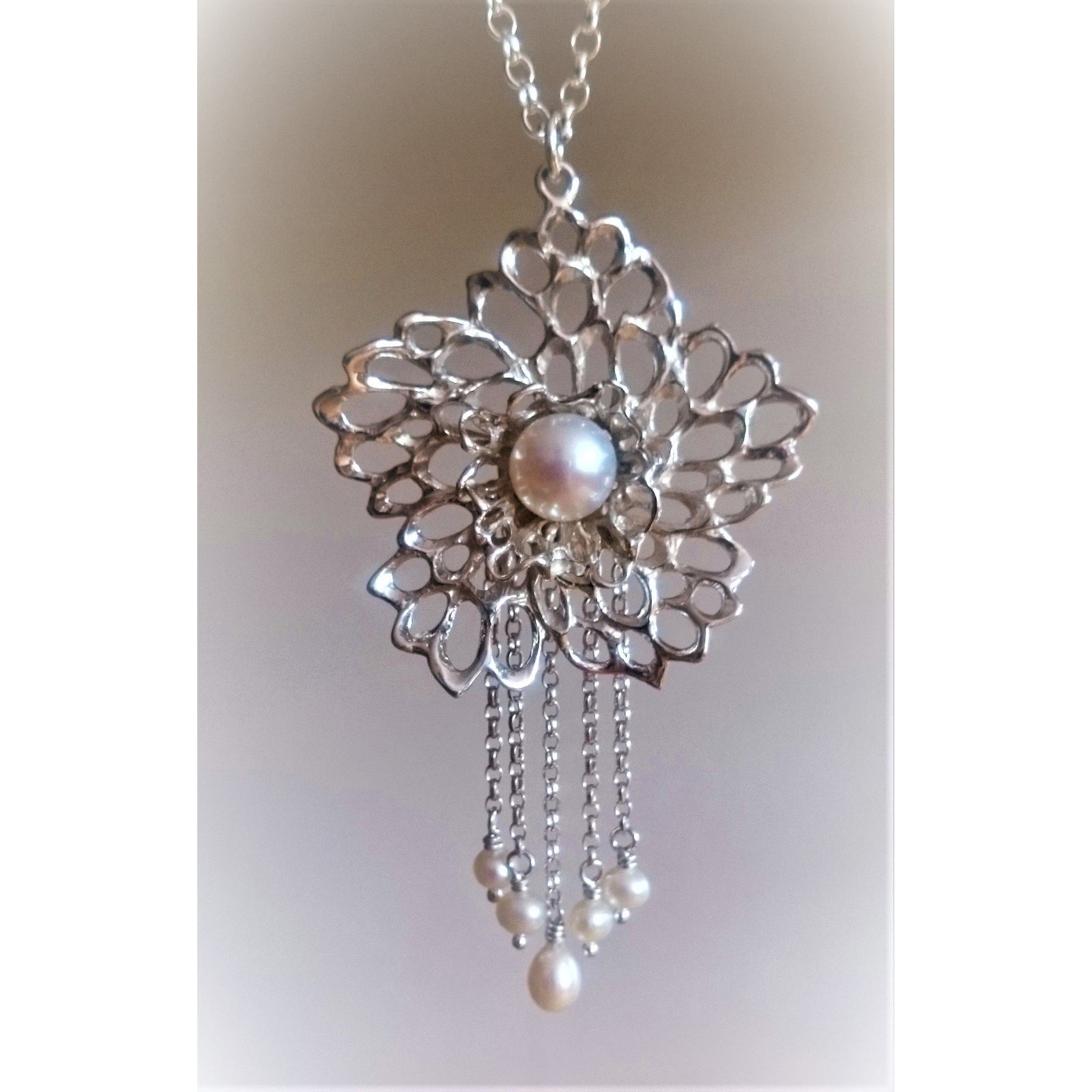 Petals and pearls drop pendant made of sterling silver and handmade in Cavan, Ireland.