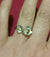 Fire of Freedom 1916 Lily Ring with gold detail worn on finger.