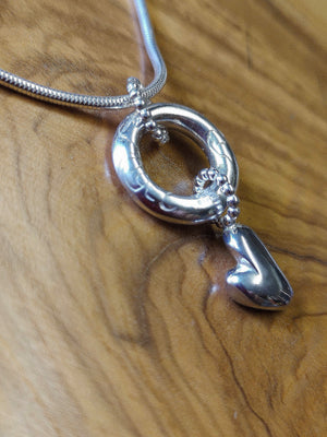 The sterling silver angel halo and heart pendant, part of Elena's My Angel jewellery collection.