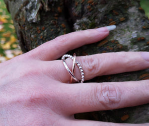 A hand showing off the Cúrsa an tSaoil Circles of Life tactile ring. Handmade in Ireland.