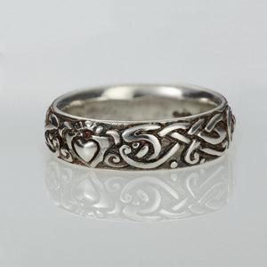 The Celtic Claddagh ring is an Irish wedding ring handmade by Irish Jewellery Designer Elena Brennan. This Irish wedding ring is made of sterling silver