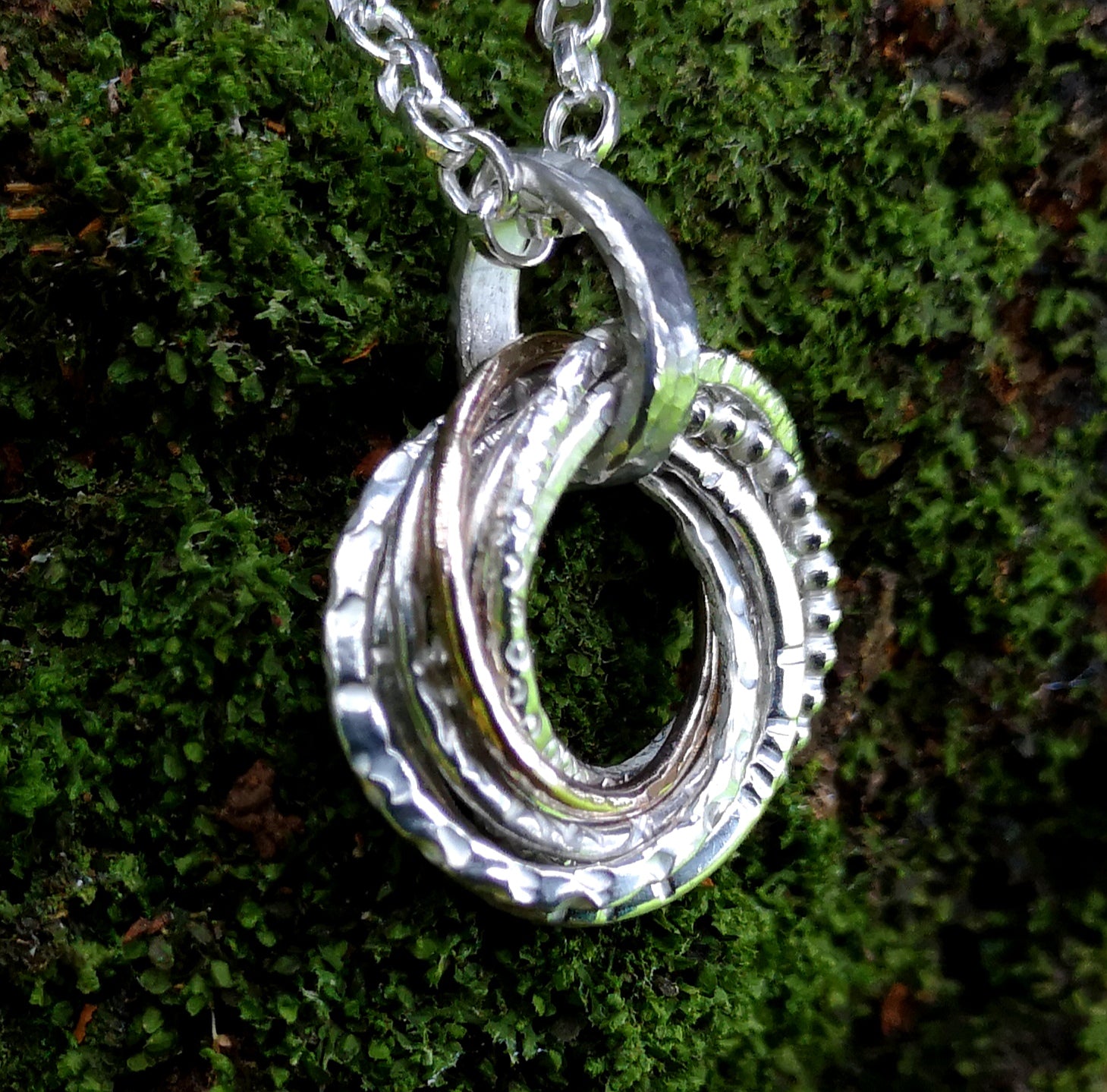 Life story hoops bespoke pendant made of silver and gold, by Elena Brennan Jewellery
