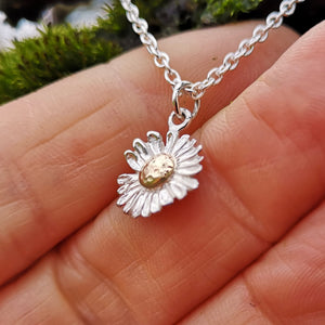 Little daisy pendant made of gold and sterling silver.