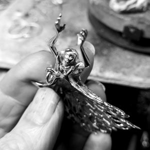 Close up of the little guardian angel pendant.