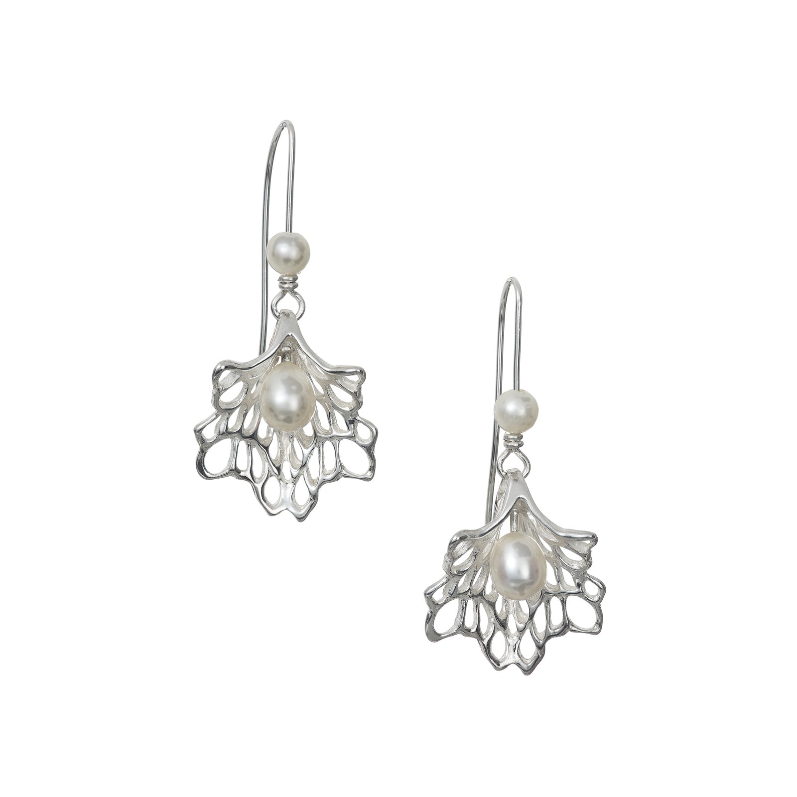 Lacy sterling silver earrings with a pearl nestled in it's centre. Handmade and designed in Ireland by Elena Brennan Jewellery.