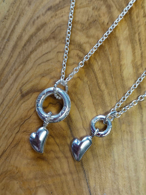 Sterling silver halo and chunky heart pendants, made in Ireland. Part of Elena Brennan's My Angel jewellery collection.