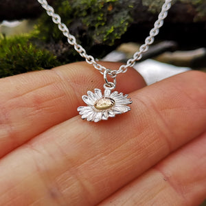 Little daisy pendant made of gold and sterling silver.