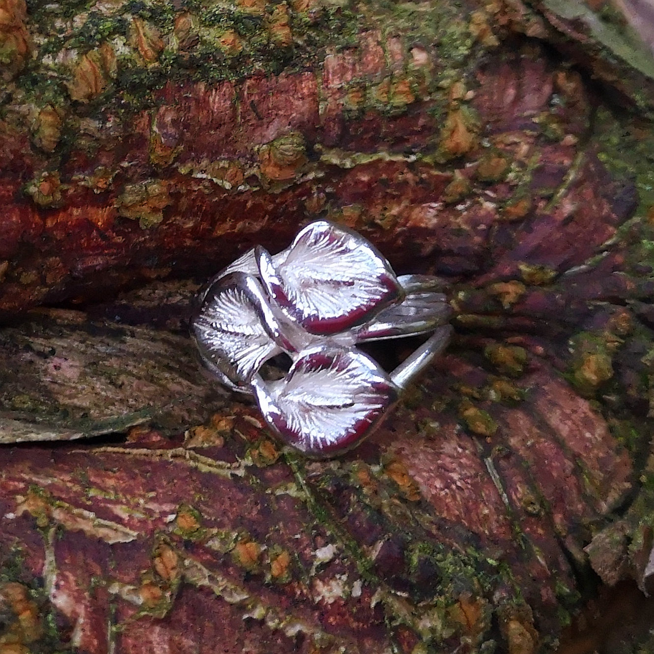 Trinity peace lily sterling silver ring, handmade by Irish jewellery designer Elena Brennan in Cavan, Ireland.