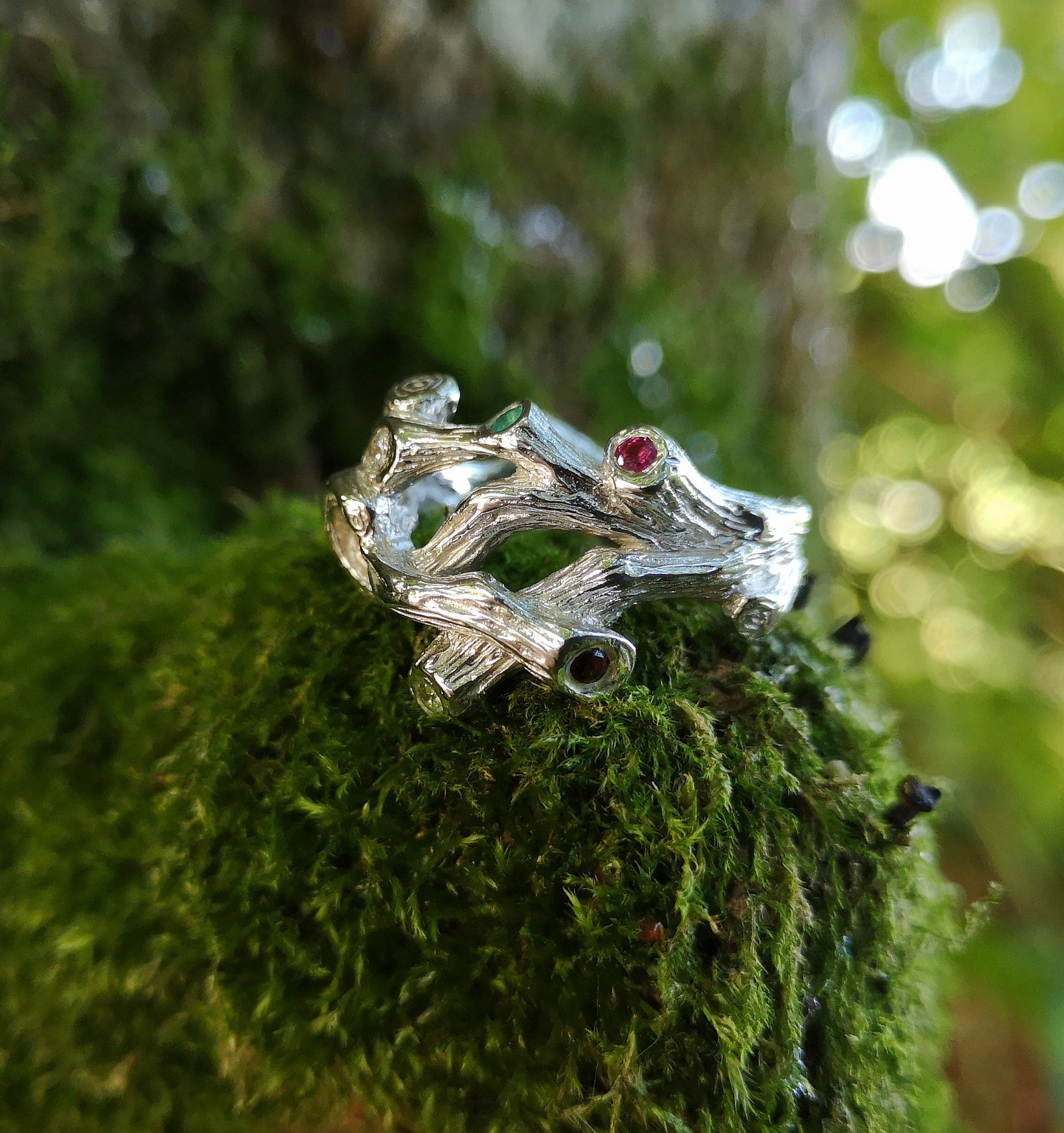 A sterling silver family birthstones ring in the shape of twigs, handmade in Cavan, Ireland, by Irish jewellery designer Elena Brennan.