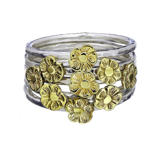 Tiny Flower Stacking Rings worn together forming a beautiful bunch.
