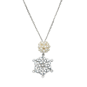 Celtic Snowflake Pendant detailing of the Trinity Knot Snowflake and Freshwater Pearl snowball.