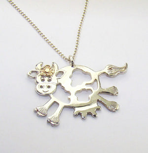 Daisy the Cow Pendant complete with a dainty 14ct gold flower, a gorgeous gift.