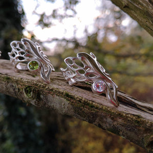 The Gossamer Butterfly Ring with Peridot and Cubic Zirconia gemstones.