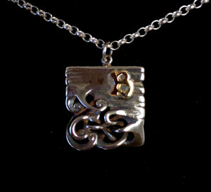 Bog Book Large Page Pendant with a 14ct Gold B Letter detailing hanging on a sterling silver chain.