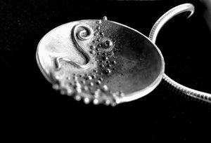 Cúrsa an tSaoil  large concave pendant handcrafted by Irish Jewellery Designer Elena Brennan.